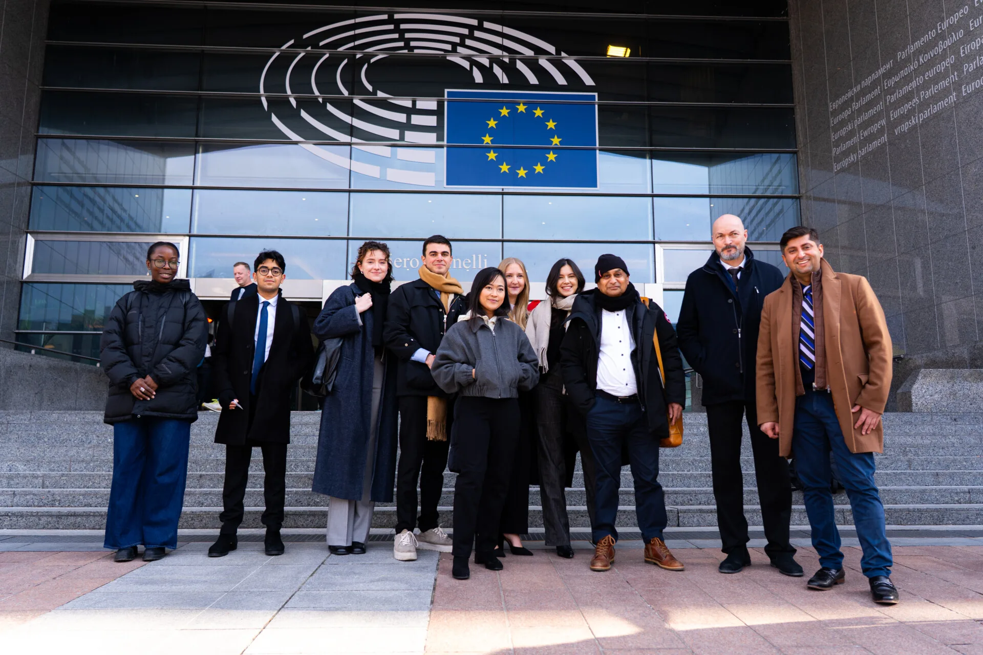GHRD team standing in front of European Union in Brussels, Belgium