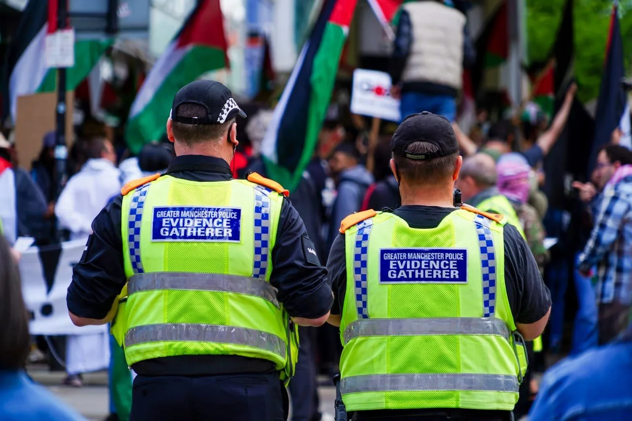 Police present at a Palestinian solidarity protest in Manchester, United Kingdom, June 2024. Photo Source: © Mylo Kaye on Pexels.